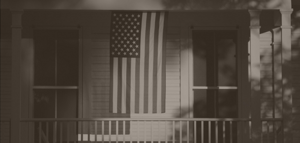 American flag hanging on house